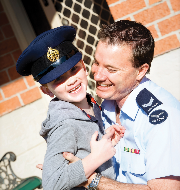 Defence (RAAF) family. Father and son outside their DHA home